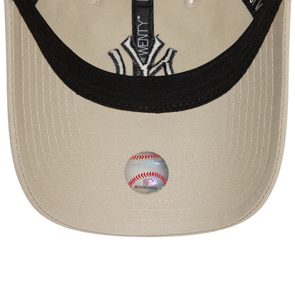 New York Yankees League Essential Core Stone New Era 9TWENTY Adjustable Cap, inside view showing a black sweatband, New Era taping, embroidered NY logo, and round MLB sticker on a beige undervisor.