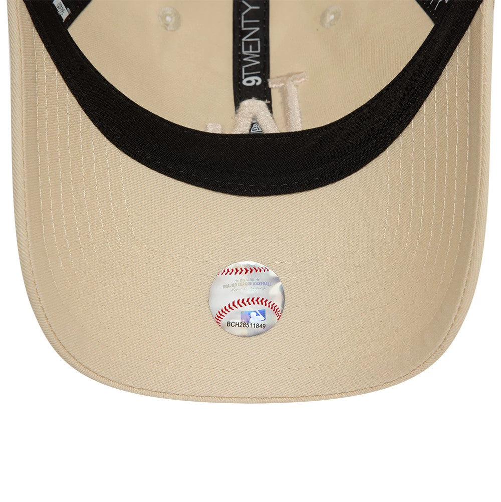 LA Dodgers League Essential Stone New Era 9TWENTY Adjustable Cap, inside view showing black undervisor with an attached embroidered baseball patch, beige sweatband, and black taping with 9TWENTY branding.