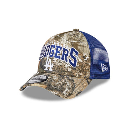 Pictured is this MLB Realtree Camo LA Dodgers 9FORTY A-Frame Trucker Adjustable cap in dark blue. 1