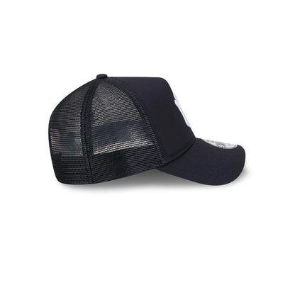New York Yankees MLB Evergreen Navy New Era 9FORTY A-Frame Adjustable Cap, side view showing the white embroidered NY logo on the front panel, black mesh back panels, and a 9FORTY size sticker on the curved visor.