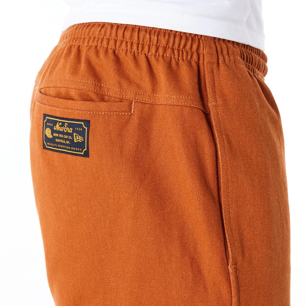 The Male model is wearing New Era Brown Cargo Trousers 6
