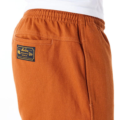 The Male model is wearing New Era Brown Cargo Trousers 6