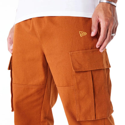 The Male model is wearing New Era Brown Cargo Trousers 7