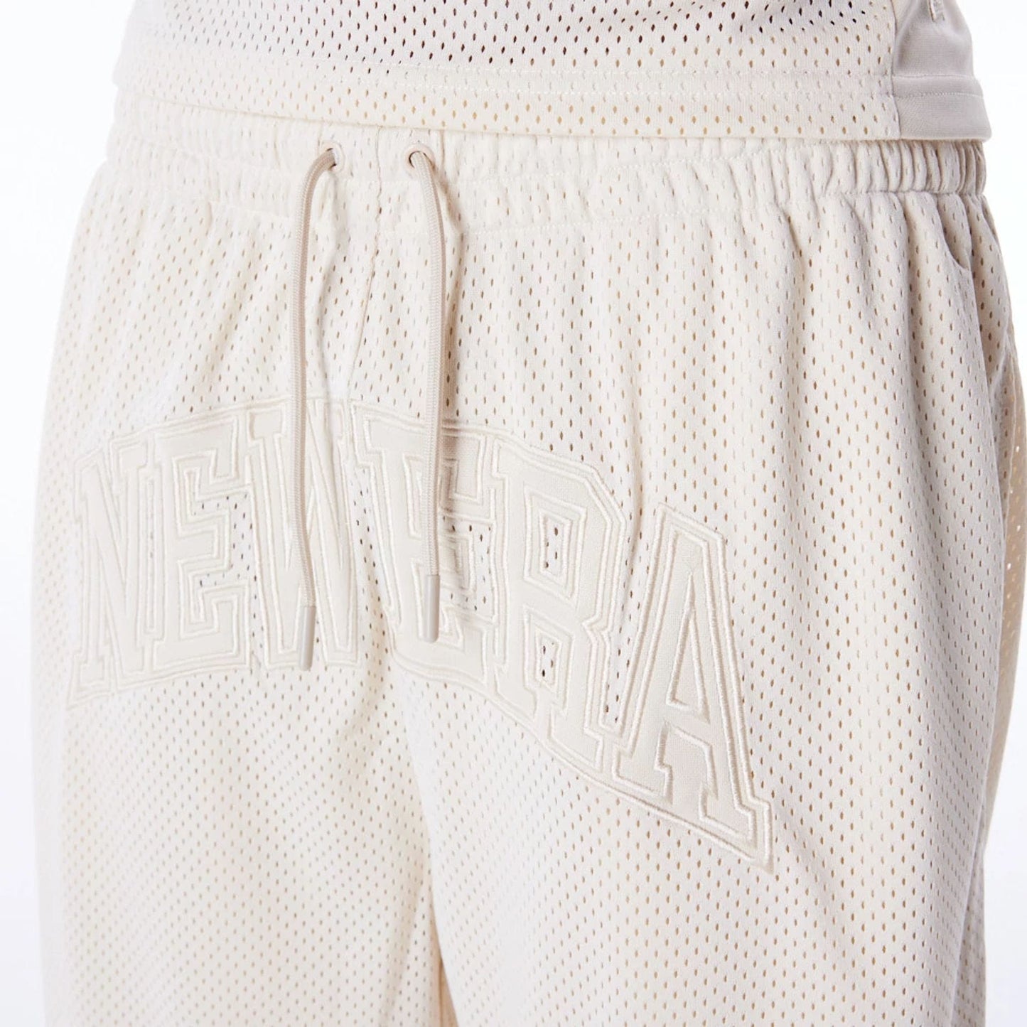 The Male model is wearing New Era Mesh Stone Oversized Shorts 4