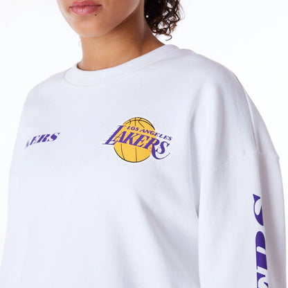 The Female model is wearing LA Lakers Womens NBA Wordmark White Crop Crew Neck Sweatshirt 6