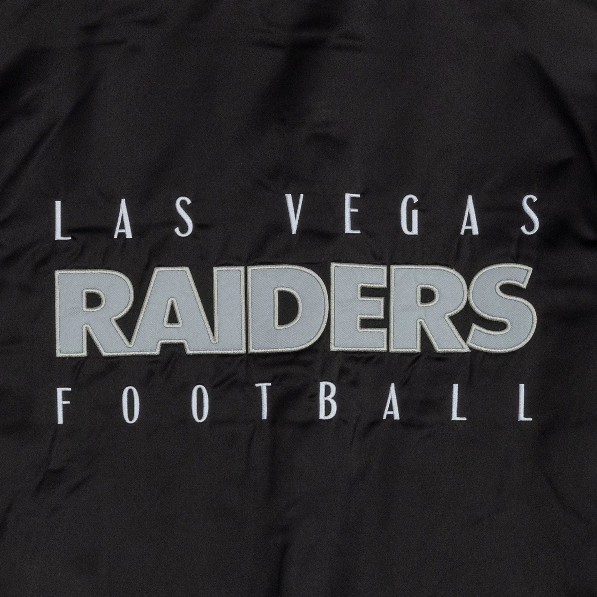 The Male model is wearing Las Vegas Raiders NFL Satin Black Bomber Jacket 2