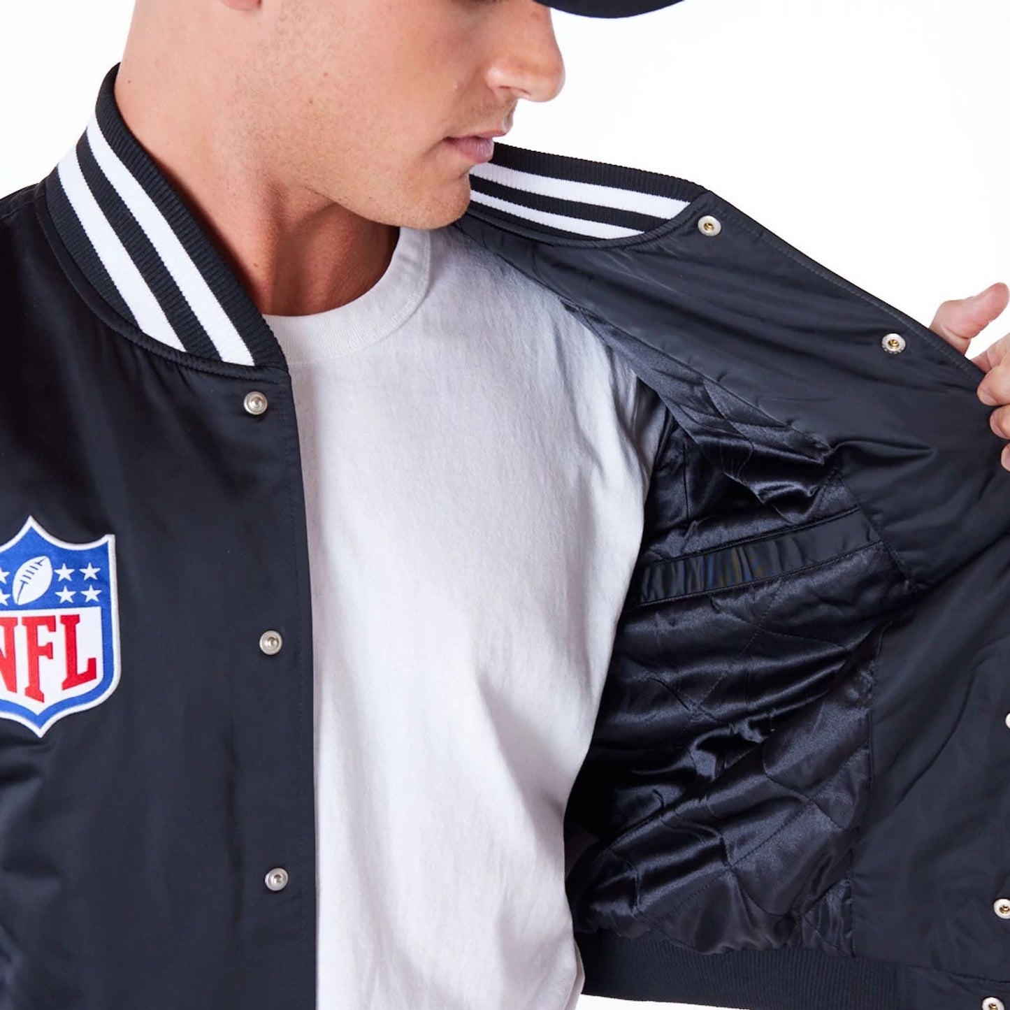 The Male model is wearing Las Vegas Raiders NFL Satin Black Bomber Jacket 3