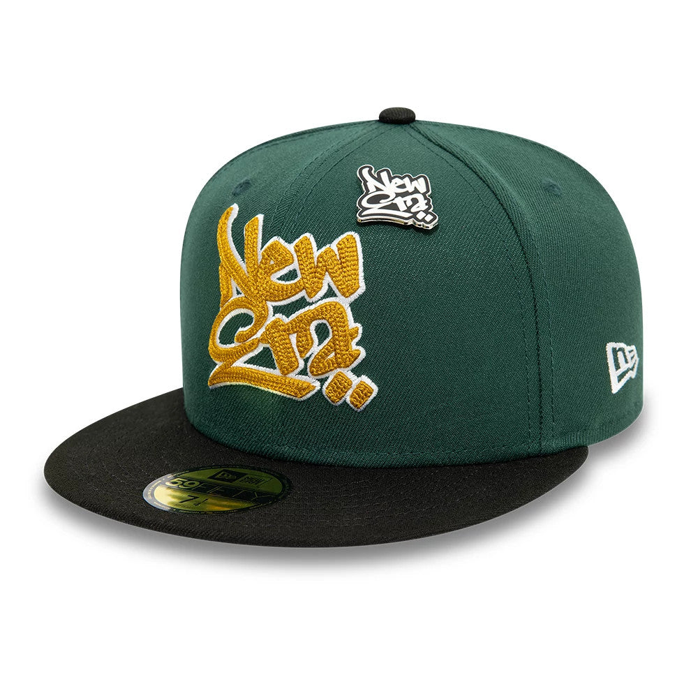 New Era Front Script Dark Green & Black New Era 59FIFTY Fitted Cap, front view showing raised gold and white embroidered New Era logo on the front panel, with a black flat visor and gold 59FIFTY size sticker on the visor, and New Era flag logo on the left side.