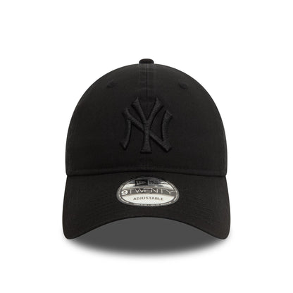 New York Yankees Washed Black New Era 9TWENTY Adjustable Cap, front view showing a black raised embroidered Yankees logo on the front panel, with a curved visor and 9TWENTY size sticker on top.