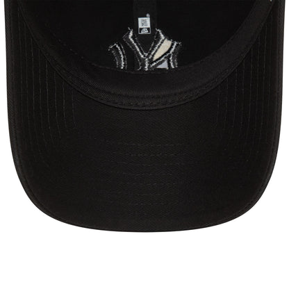 New York Yankees Washed Black New Era 9TWENTY Adjustable Cap, inside view with black taping and sweatband, showing the underside of the black visor and an embroidered Yankees logo on the inner lining.