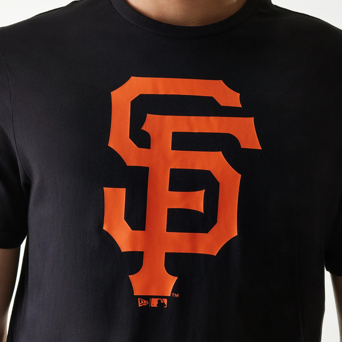 New Era San Francisco Giants MLB Regular Black T-Shirt, front view showing a large orange interlocking SF logo printed in the centre of the chest with a small debossed New Era logo below it.