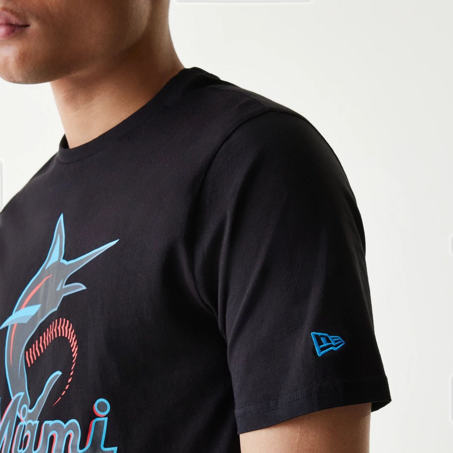 The Male model is wearing Miami Marlins MLB Regular Black T-Shirt 5