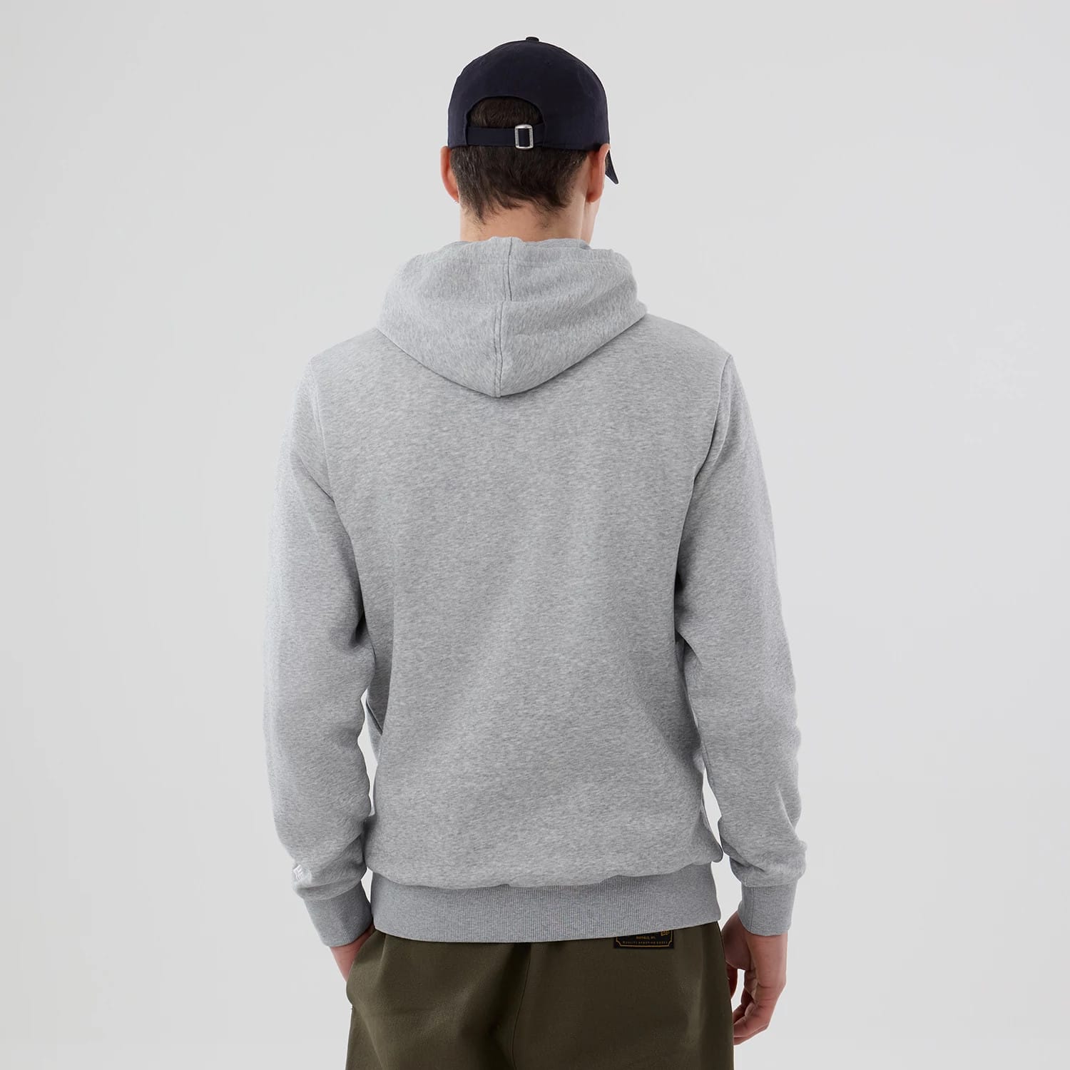 New Era Kansas City Royals MLB Grey Pullover Hoodie, rear view showing the grey hoodie with a relaxed fit, long sleeves, and a hood resting flat against the upper back, worn by a model in dark trousers and a dark cap.