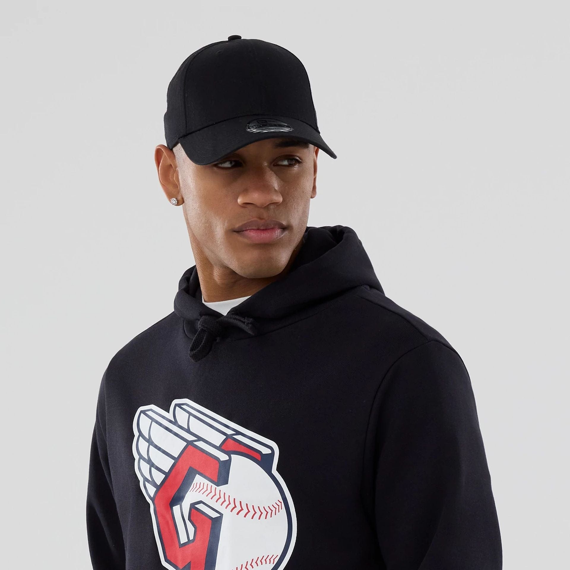 The Male model is wearing Cleveland Guardians MLB Navy Pullover Hoodie 6