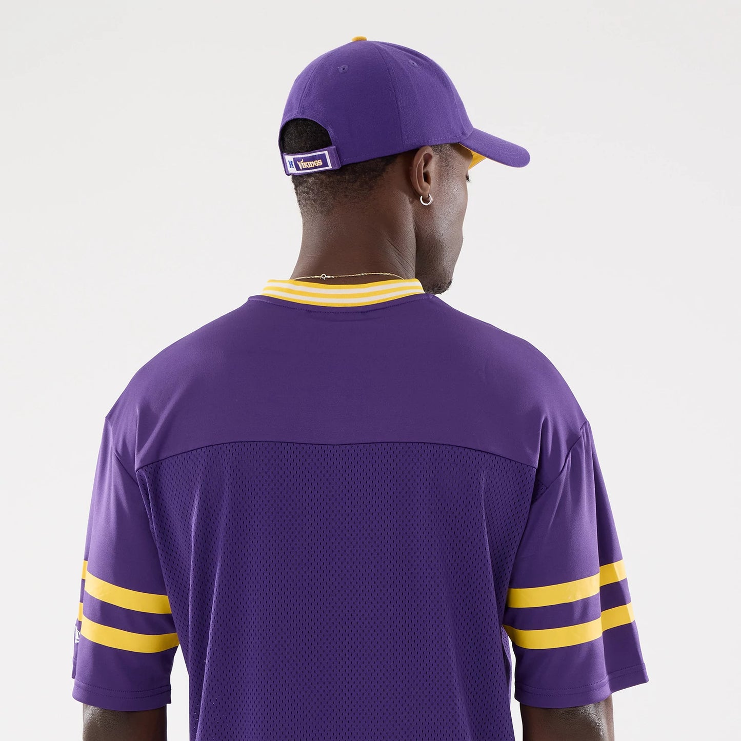 The Male model is wearing Minnesota Vikings NFL Mesh Purple Mesh Jersey 7