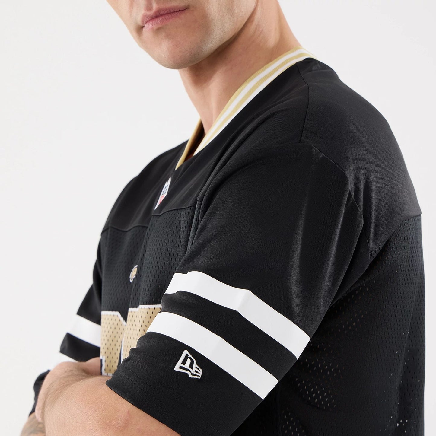 The Male model is wearing New Orleans Saints NFL Mesh Black Mesh Jersey 4