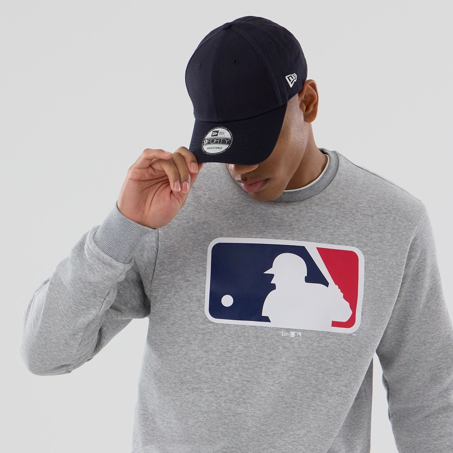 The Male model is wearing MLB Generic Logo Grey Crew Neck Sweater 6