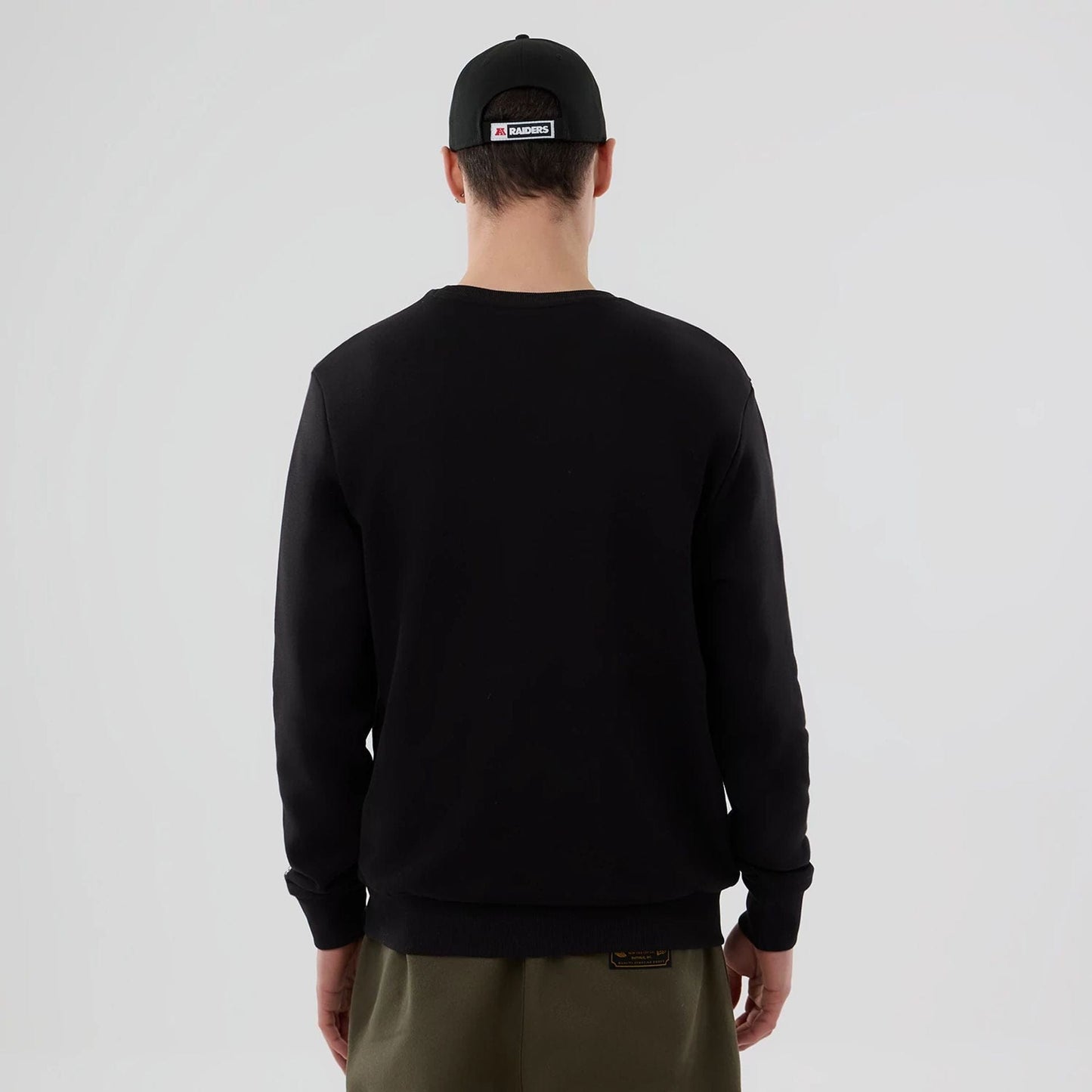 The Male model is wearing Las Vegas Raiders NFL Black Crew Neck Sweater 2