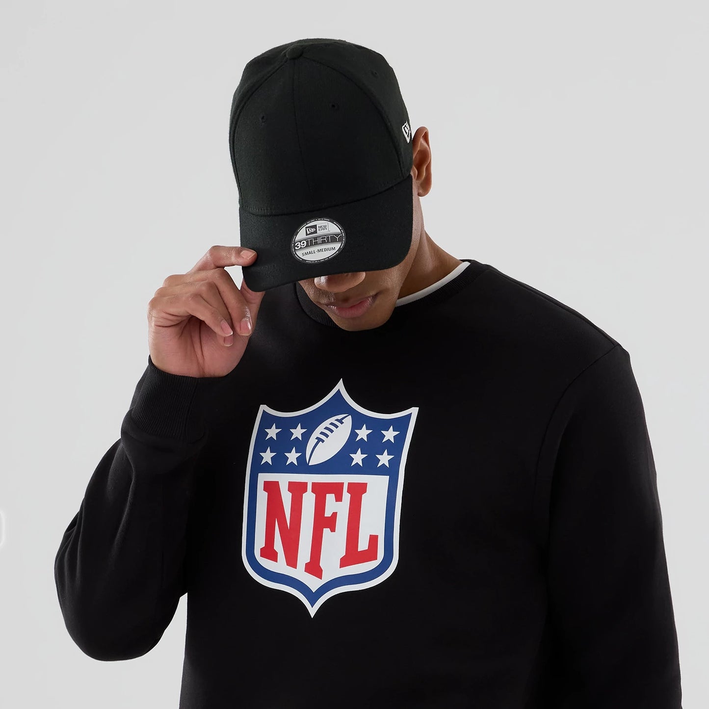 The Male model is wearing NFL Generic Logo Black Crew Neck Sweater 5