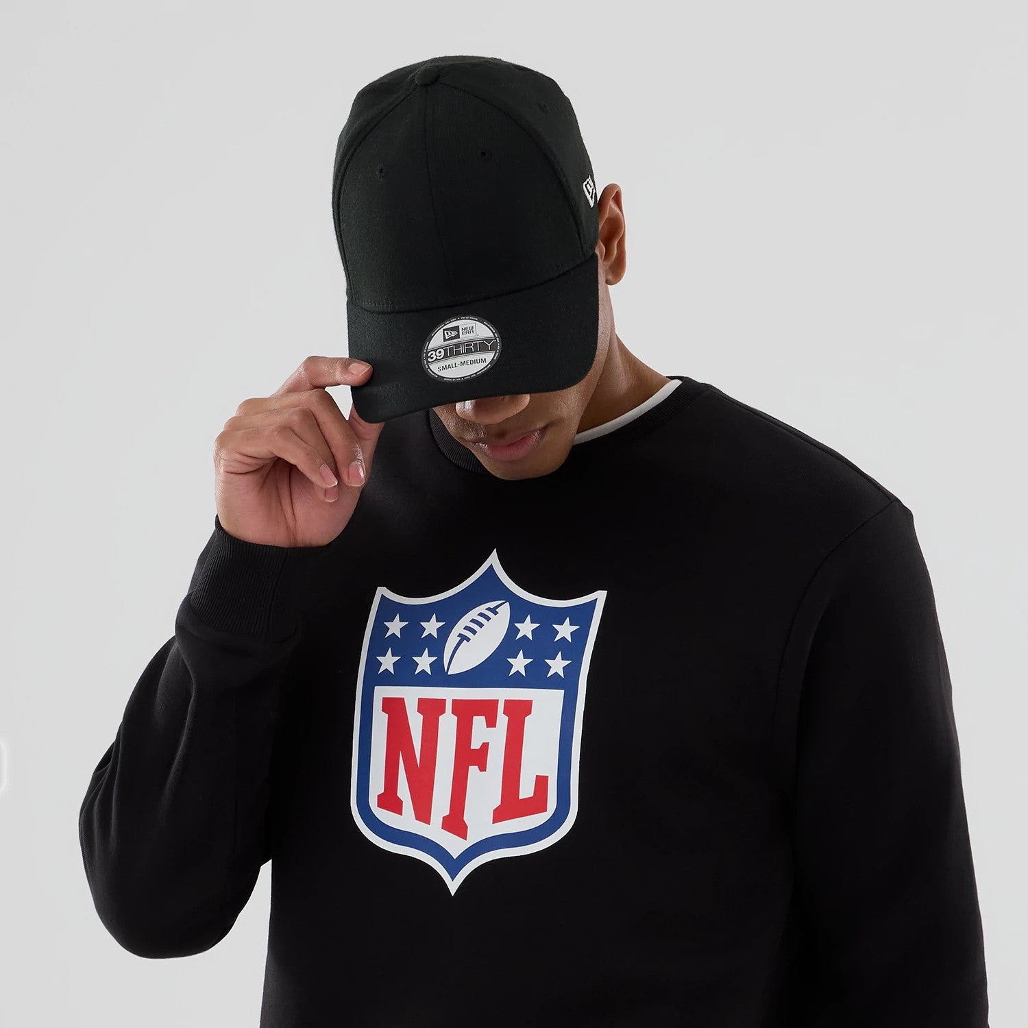 The Male model is wearing NFL Generic Logo Black Crew Neck Sweater 5