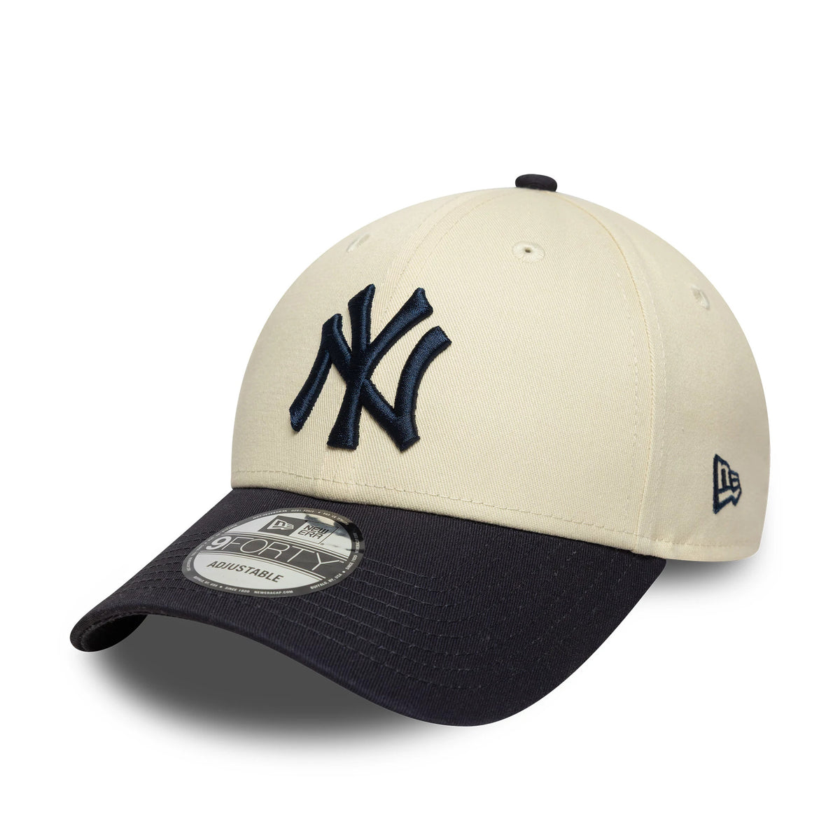 New York Yankees Colour Block Cream New Era 9FORTY Adjustable Cap, front view showing the raised embroidered navy NY logo on the front panel, with a contrasting navy visor and a 9FORTY size sticker on the curved visor.