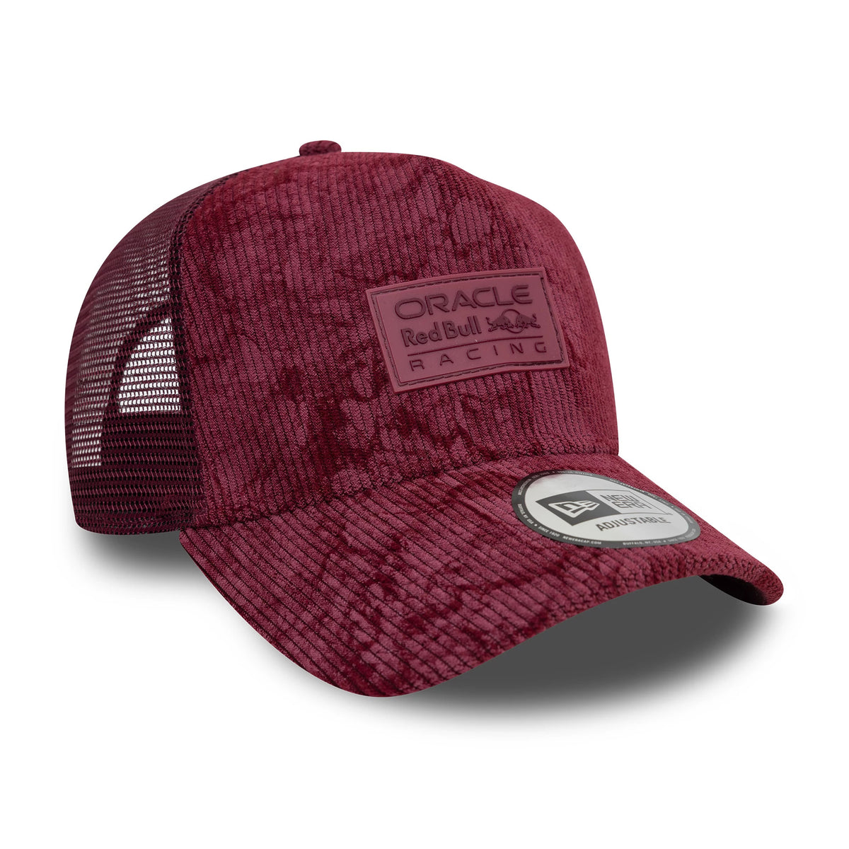Red Bull Racing Cord Open Red New Era 9FORTY A-Frame Trucker Adjustable Cap, three-quarter view with a rectangular patch logo on the front panel, black mesh on the sides, and a 9FORTY size sticker on the corduroy visor.