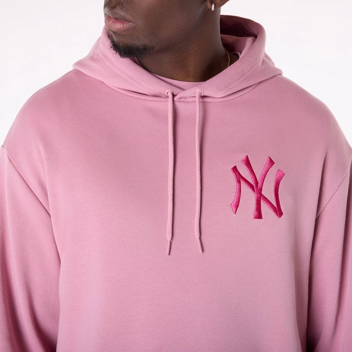 The Male model is wearing New York Yankees MLB League Essential Dark Pink Oversized Pullover Hoodie 3