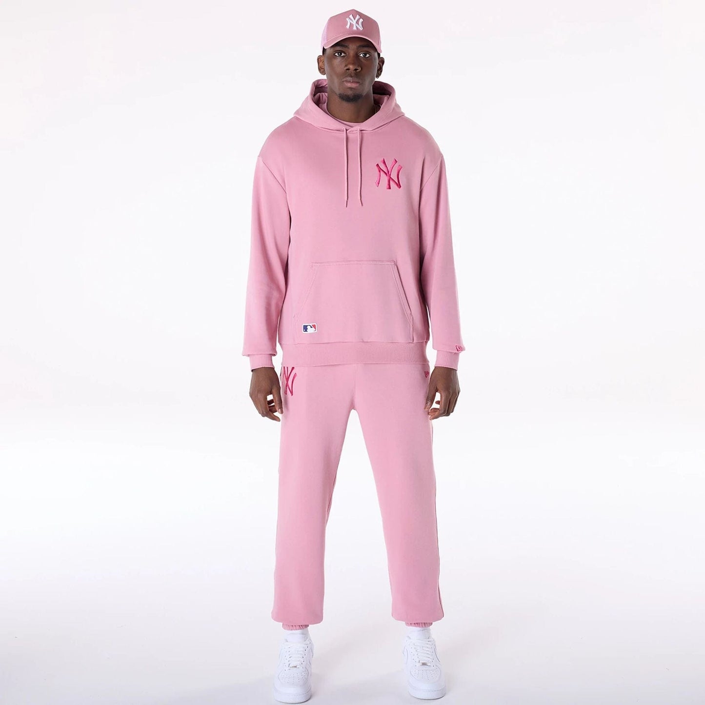 The Male model is wearing New York Yankees MLB League Essential Dark Pink Oversized Pullover Hoodie 4