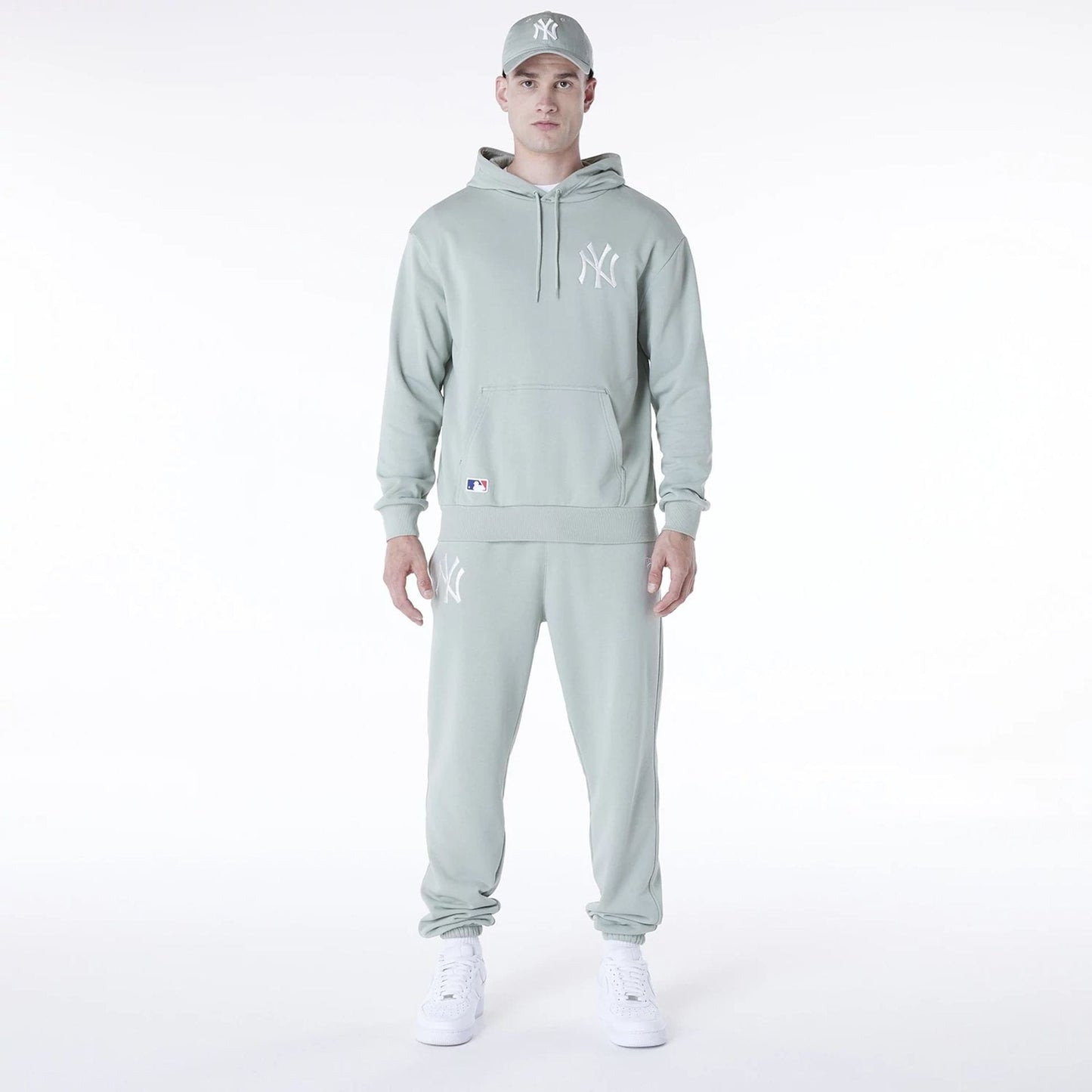 The Male model is wearing New York Yankees MLB League Essential Pastel Green Oversized Pullover Hoodie 3
