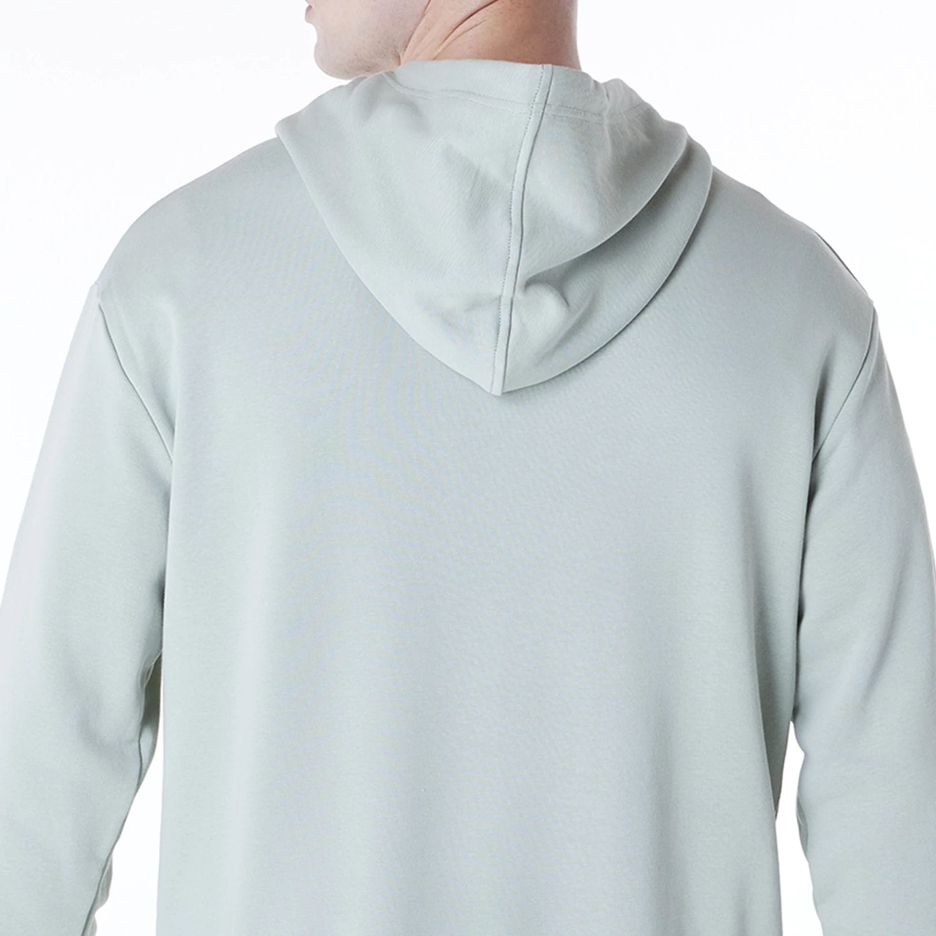 The Male model is wearing New York Yankees MLB League Essential Pastel Green Oversized Pullover Hoodie 7