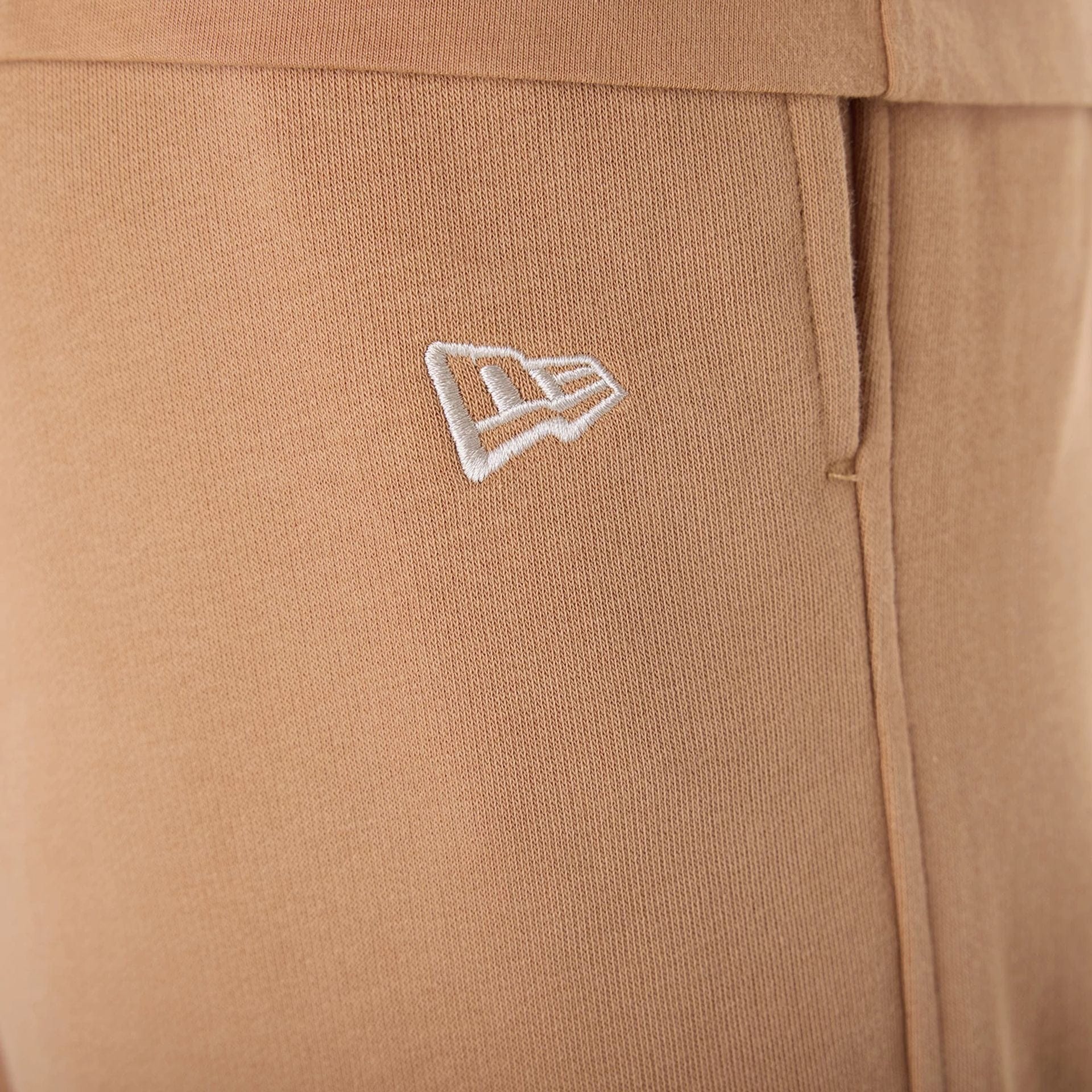 The Male model is wearing LA Dodgers MLB League Essential Dark Beige Fleece Joggers 4