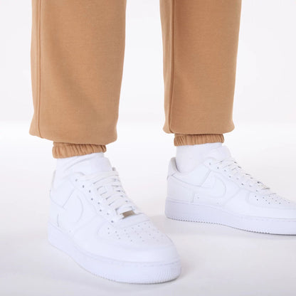 The Male model is wearing LA Dodgers MLB League Essential Dark Beige Fleece Joggers 5