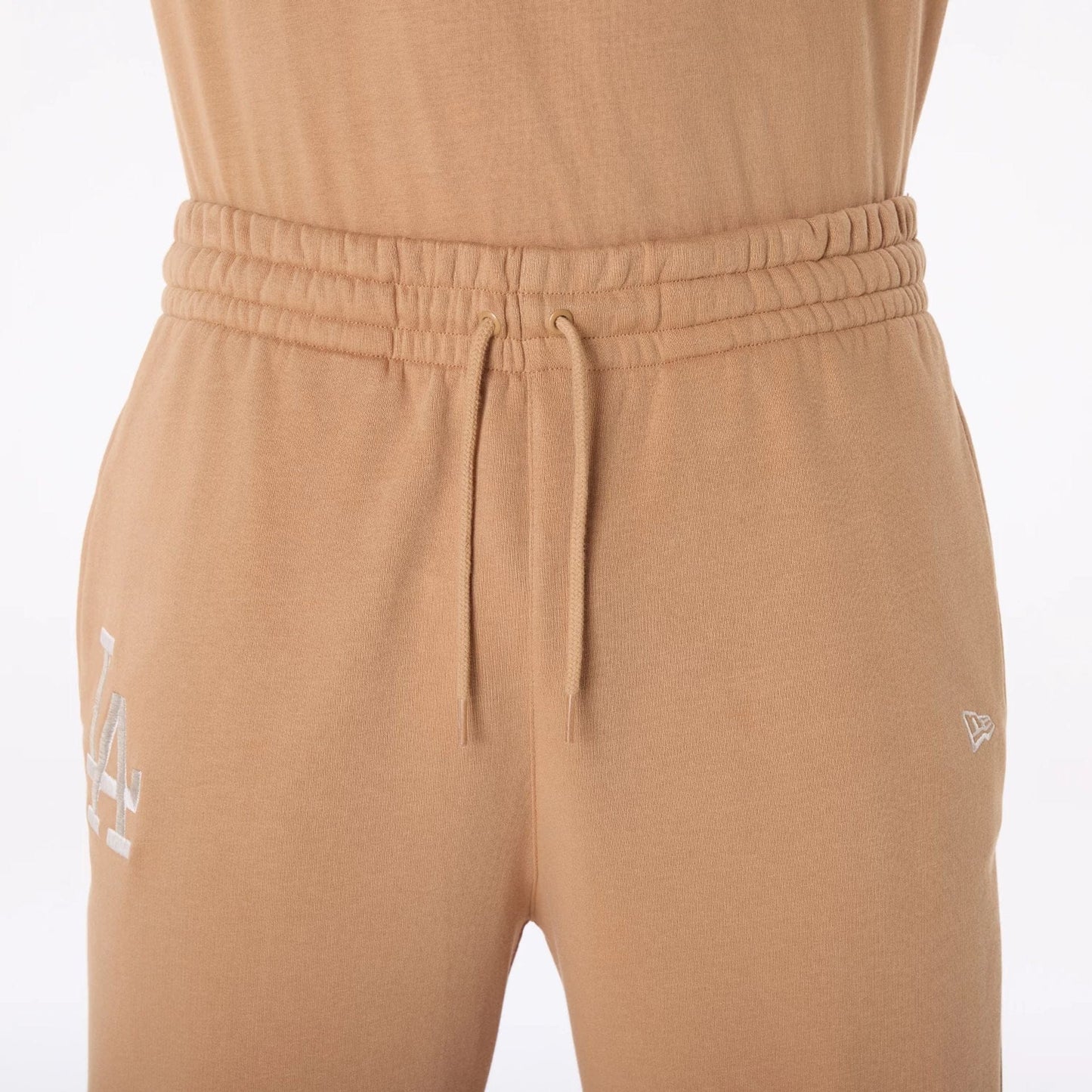 The Male model is wearing LA Dodgers MLB League Essential Dark Beige Fleece Joggers 6