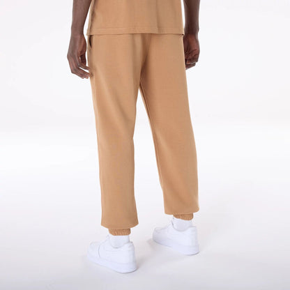The Male model is wearing LA Dodgers MLB League Essential Dark Beige Fleece Joggers 7
