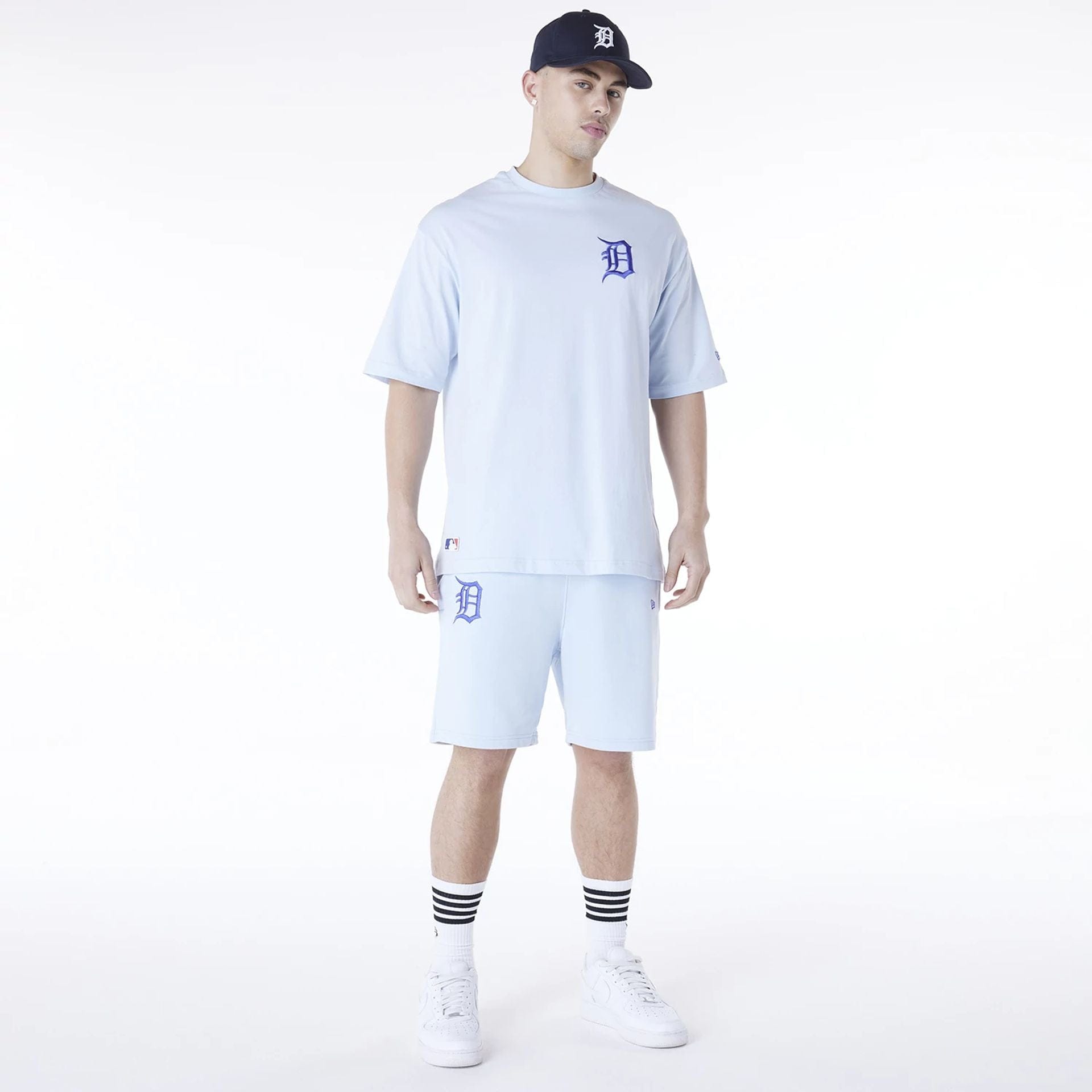 The Male model is wearing Detroit Tigers MLB League Essential Pastel Blue Shorts 7