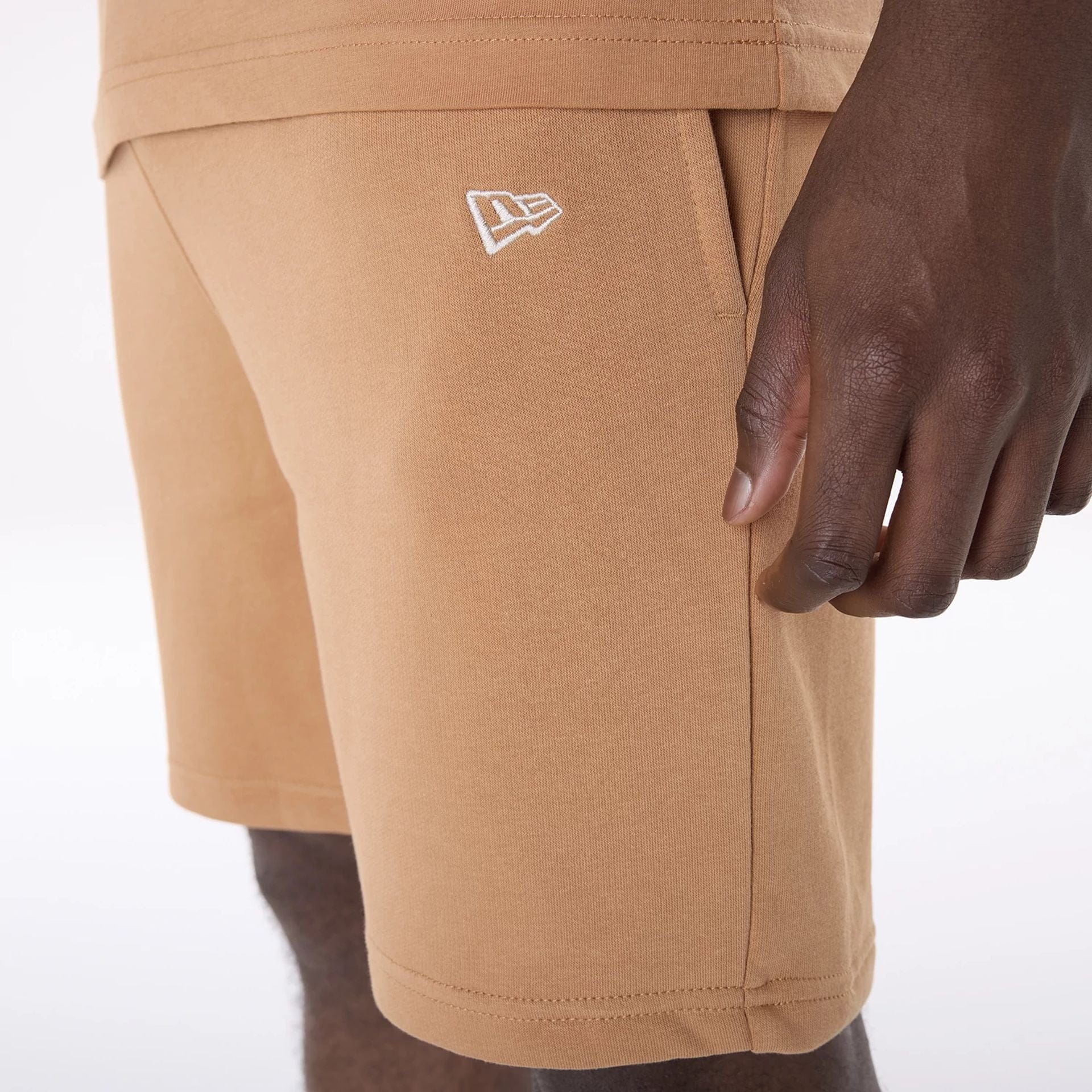 The Male model is wearing LA Dodgers MLB League Essential Dark Beige Shorts 3