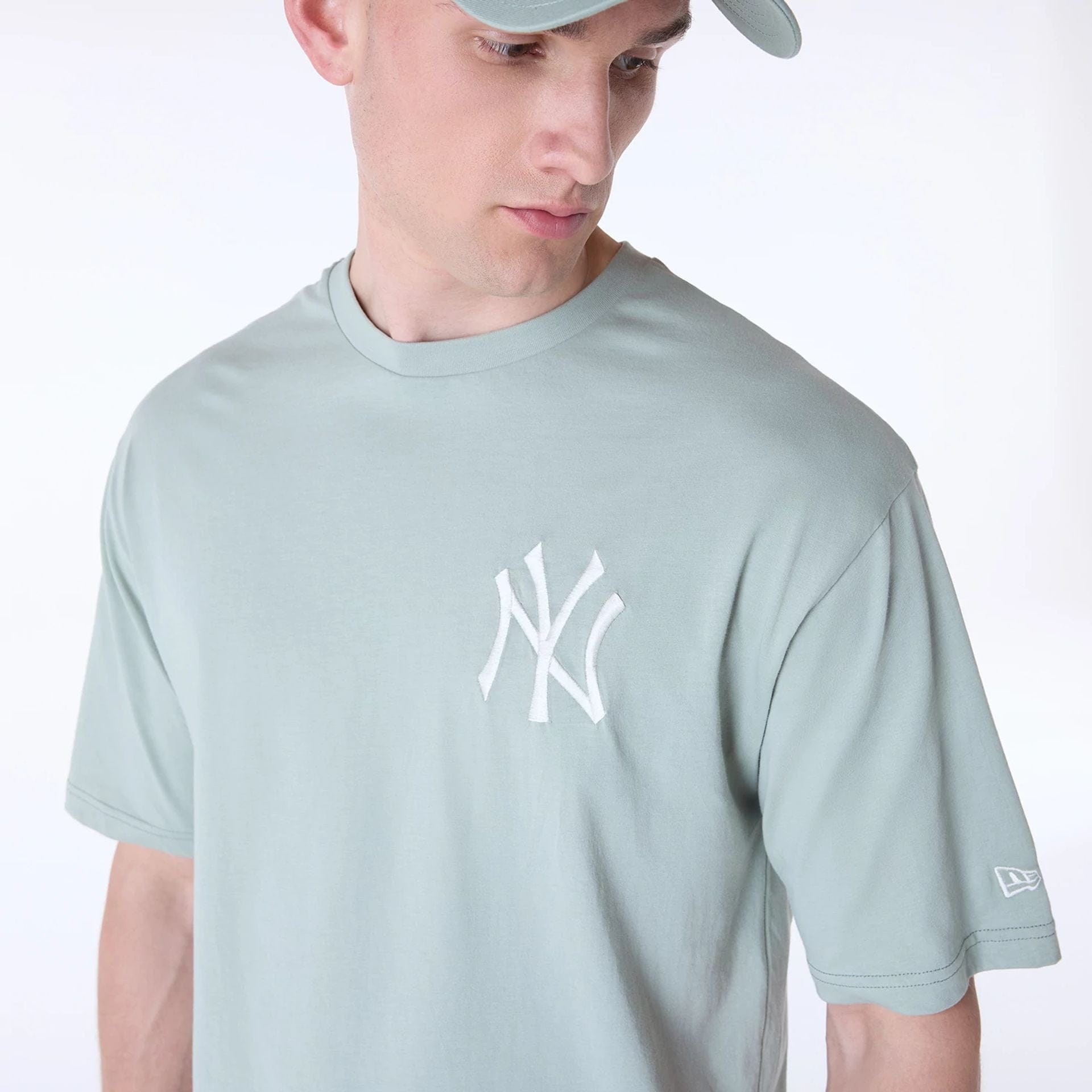 The Male model is wearing New York Yankees MLB League Essential Pastel Green Oversized T-Shirt 6