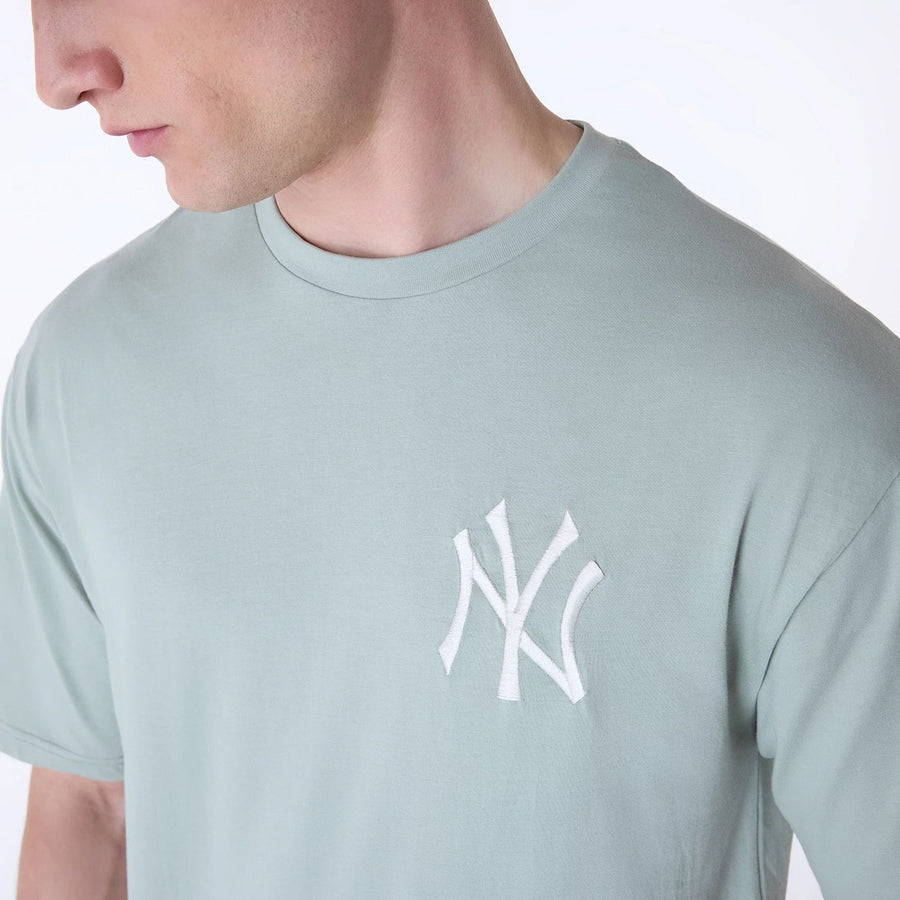 The Male model is wearing New York Yankees MLB League Essential Pastel Green Oversized T-Shirt 4