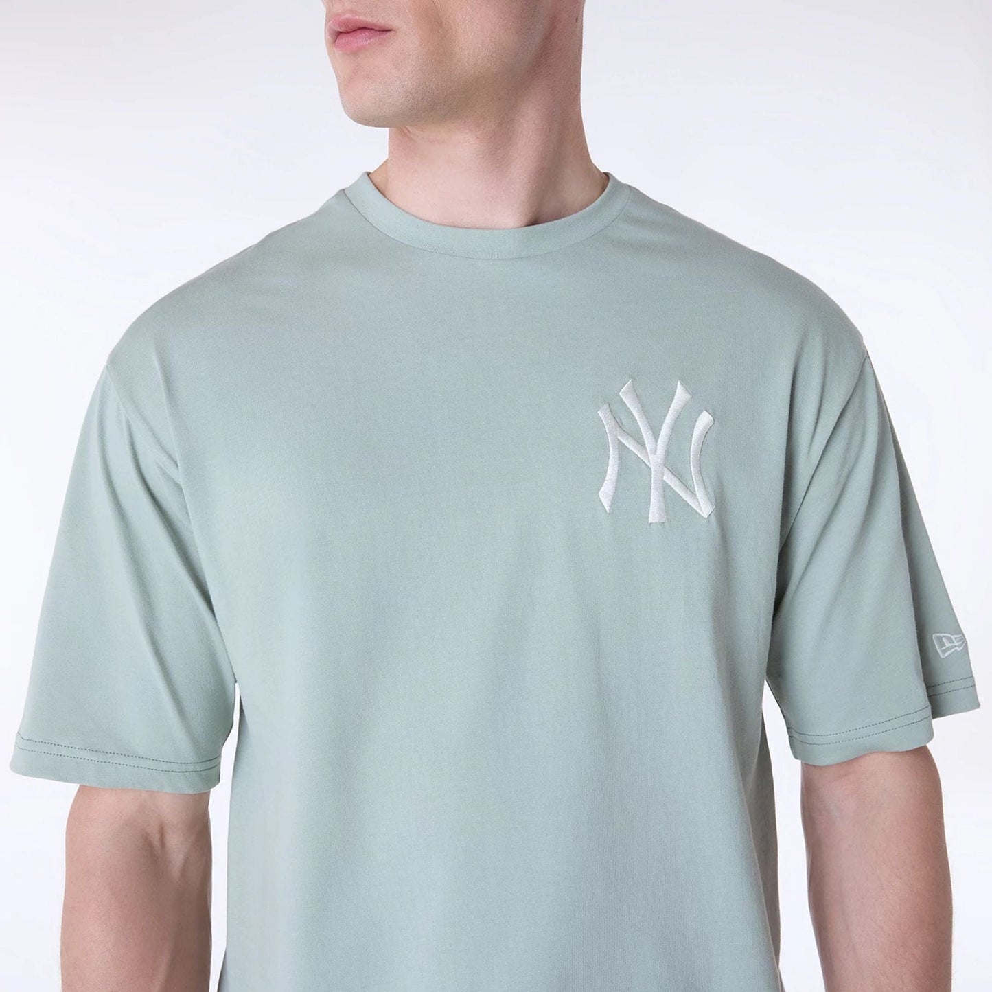 The Male model is wearing New York Yankees MLB League Essential Pastel Green Oversized T-Shirt 3