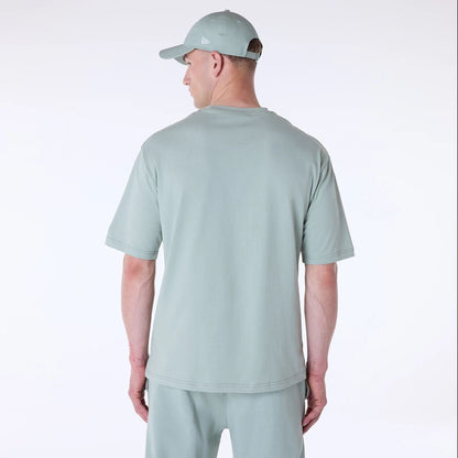 The Male model is wearing New York Yankees MLB League Essential Pastel Green Top And Shorts Set 2