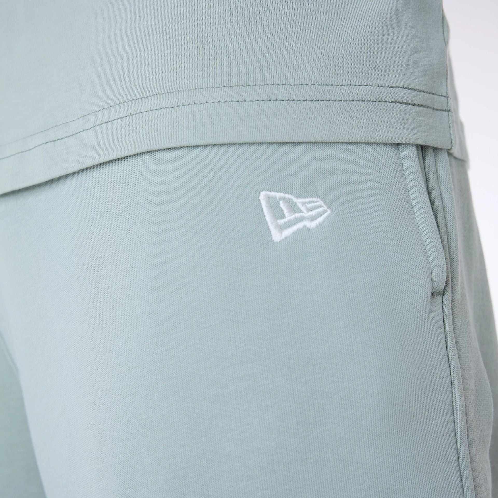 The Male model is wearing New York Yankees MLB League Essential Pastel Green Fleece Joggers 7