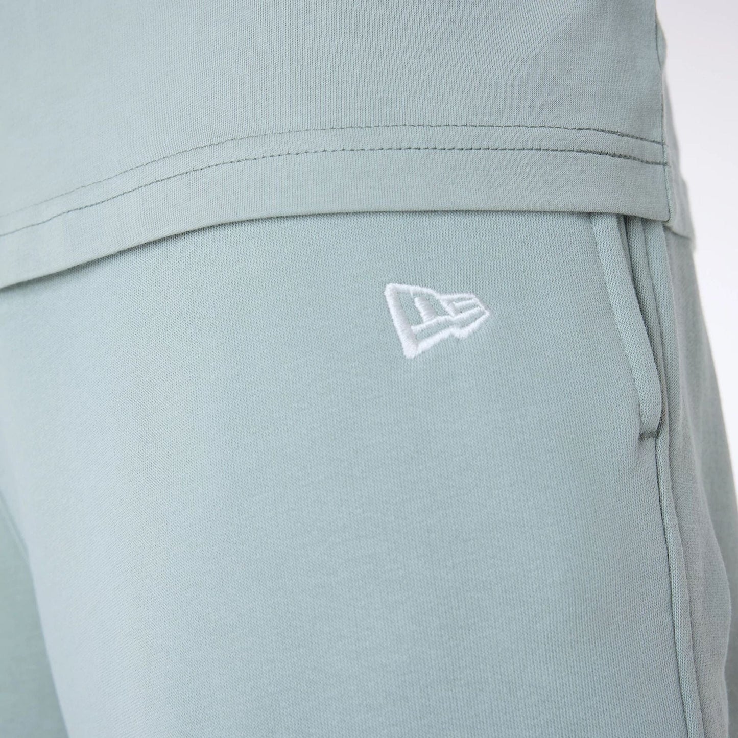 The Male model is wearing New York Yankees MLB League Essential Pastel Green Fleece Joggers 7