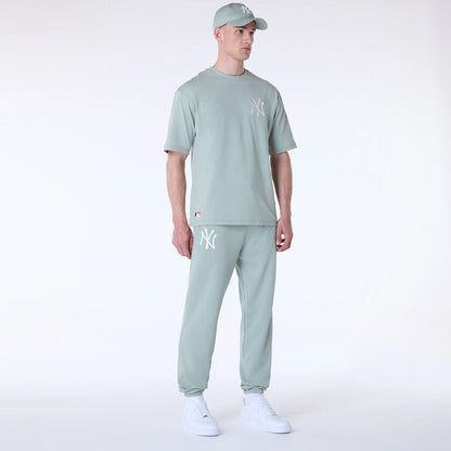 The Male model is wearing New York Yankees MLB League Essential Pastel Green Fleece Joggers 8