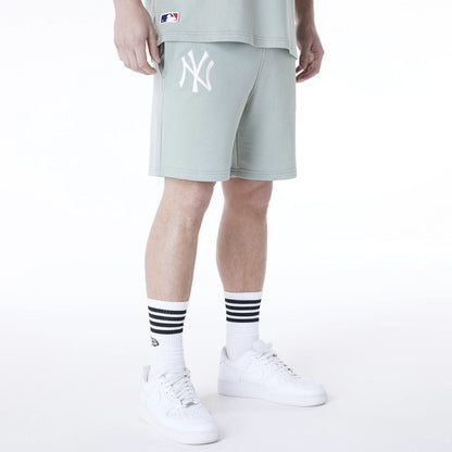 The Male model is wearing New York Yankees MLB League Essential Pastel Green Top And Shorts Set 4