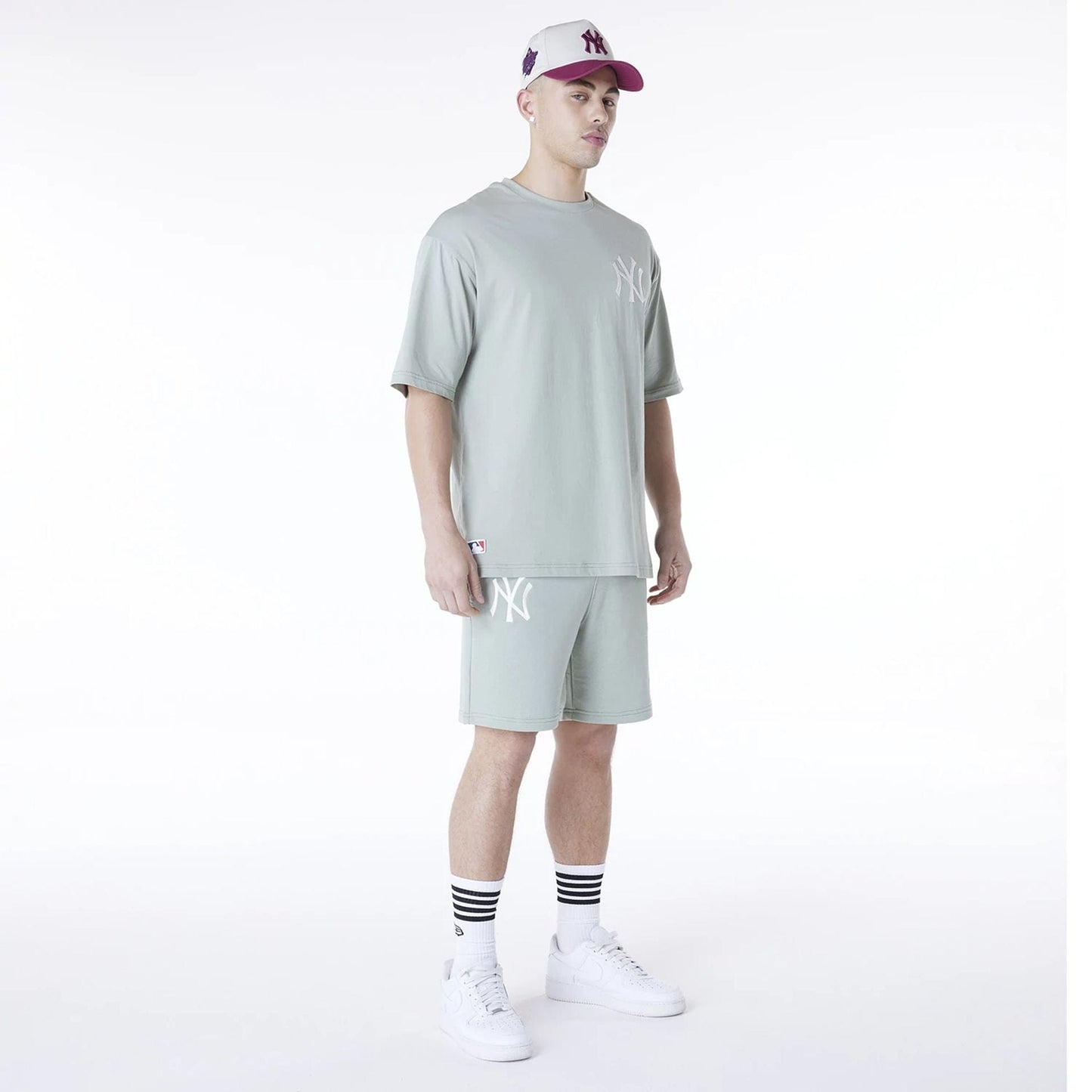 The Male model is wearing New York Yankees MLB League Essential Pastel Green Shorts 7