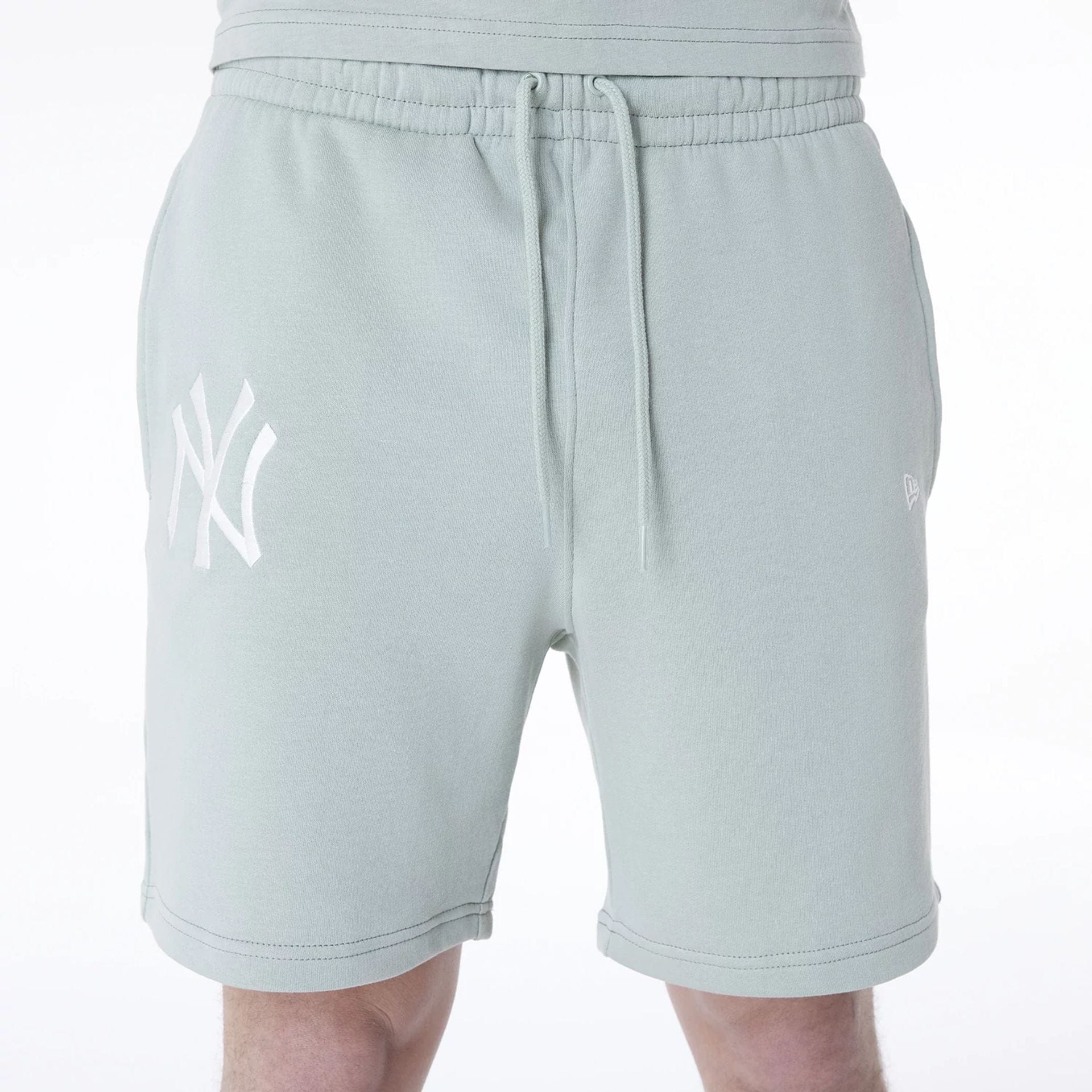 The Male model is wearing New York Yankees MLB League Essential Pastel Green Shorts 6