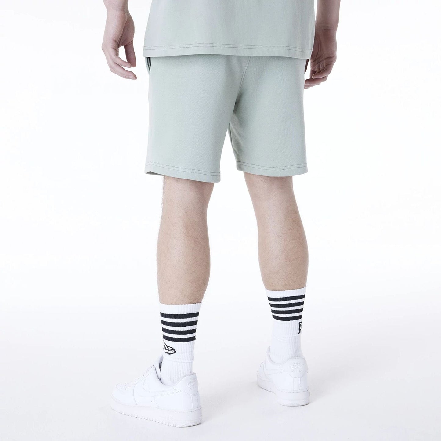 The Male model is wearing New York Yankees MLB League Essential Pastel Green Top And Shorts Set 5