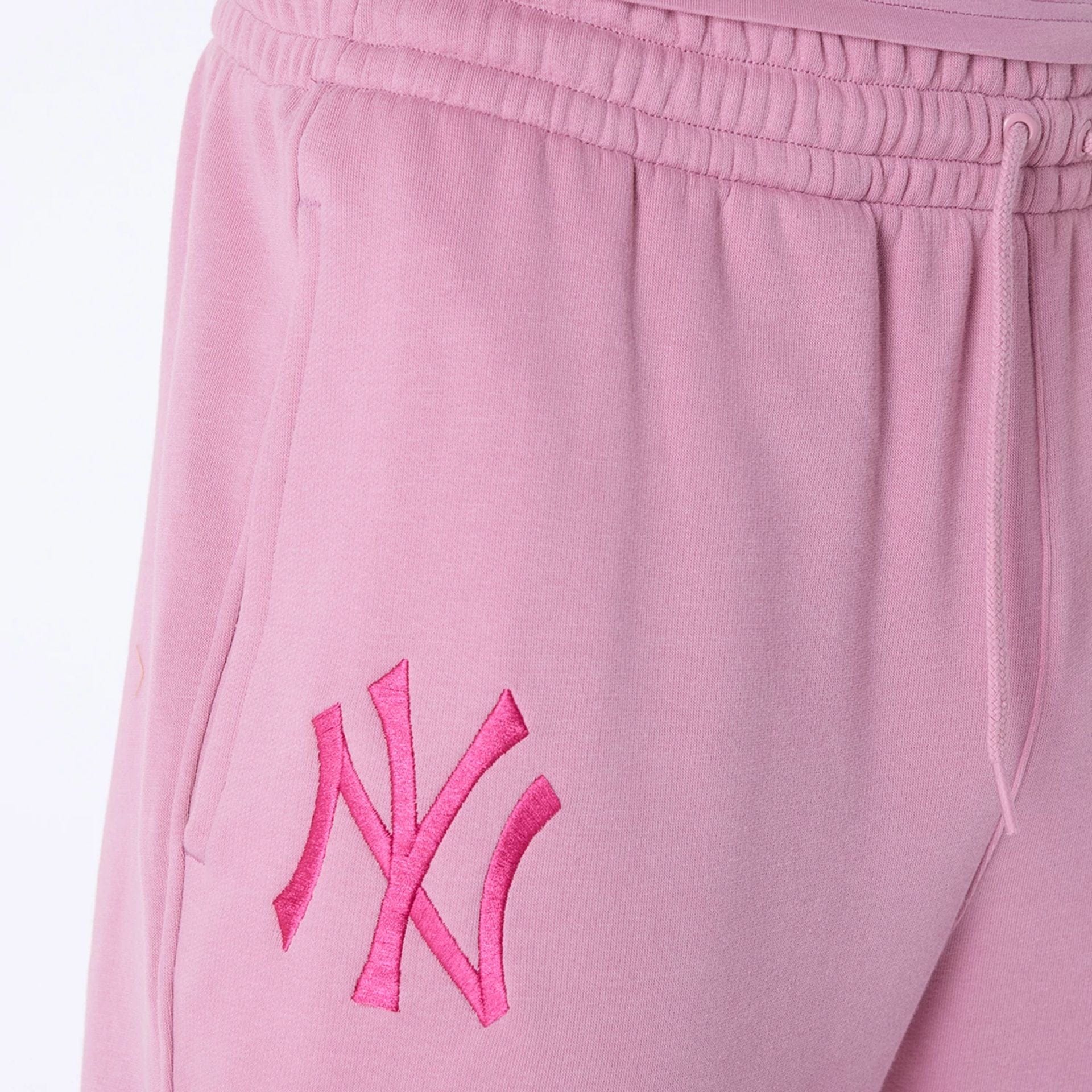 The Male model is wearing New York Yankees MLB League Essential Dark Pink Fleece Joggers 4