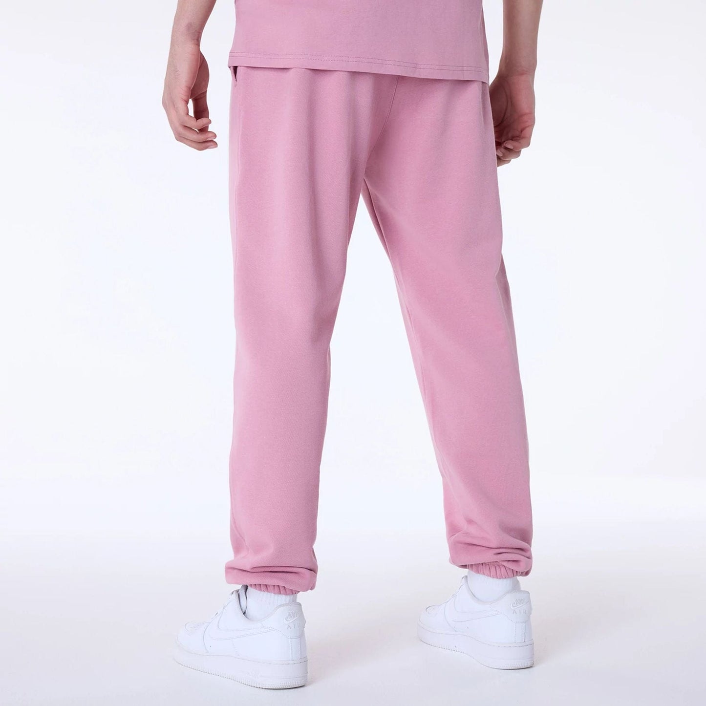 The Male model is wearing New York Yankees MLB League Essential Dark Pink Fleece Joggers 2