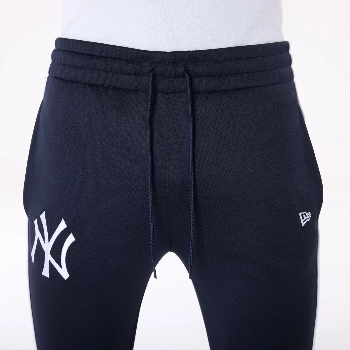 The Male model is wearing New York Yankees MLB Track Pants Navy Fleece Joggers 6